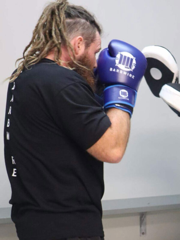 Barbwire boxing gloves in action